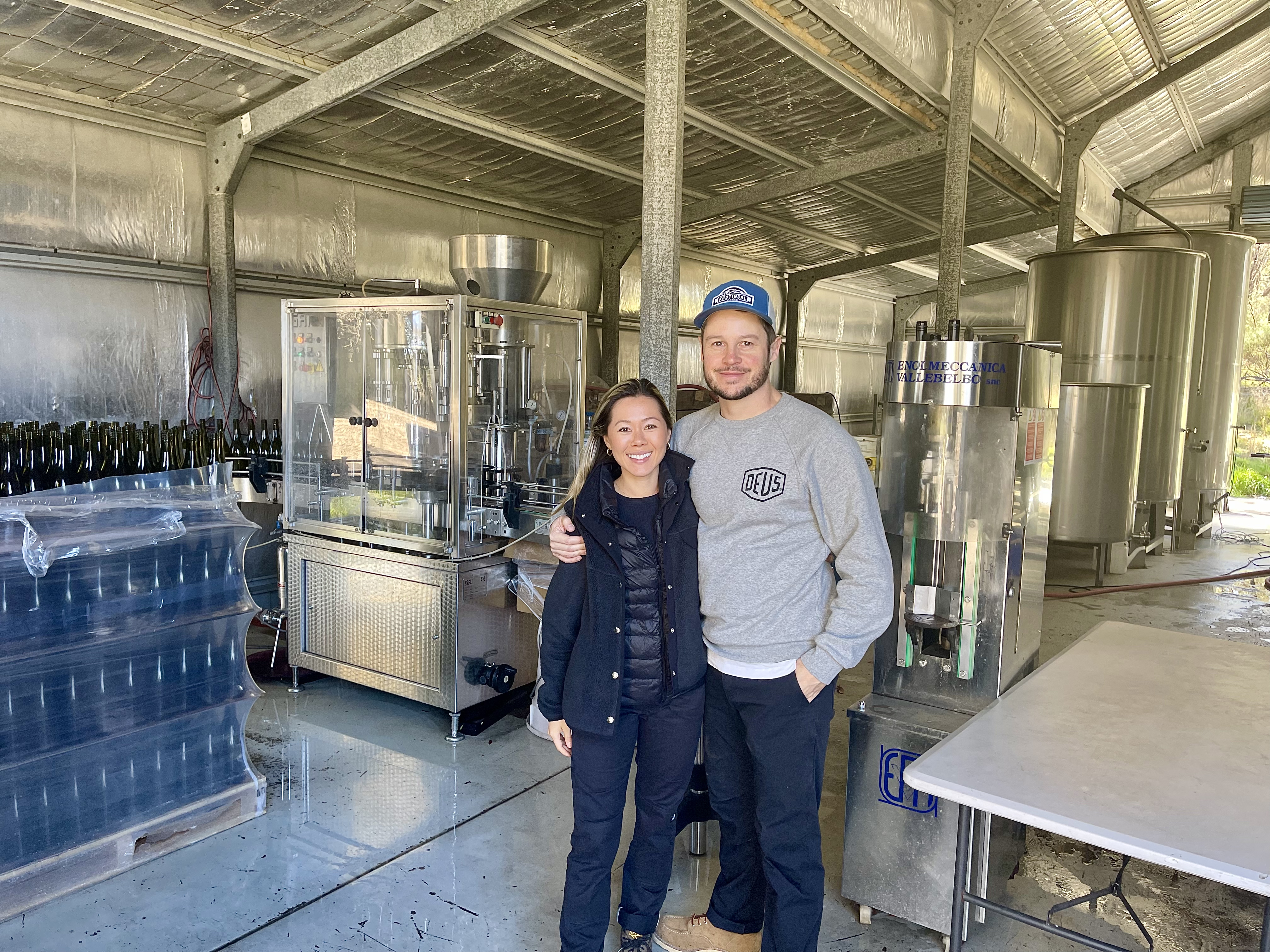 Man and woman posing in winery